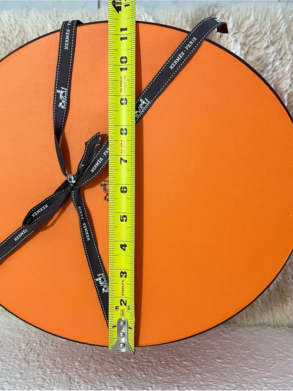 Original Hermès Orange Round Hat Box with branded brown ribbon